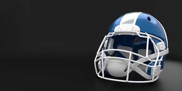 American football helmets on a reflective surface against a white background.