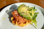 potato waffle with salmon and avocade