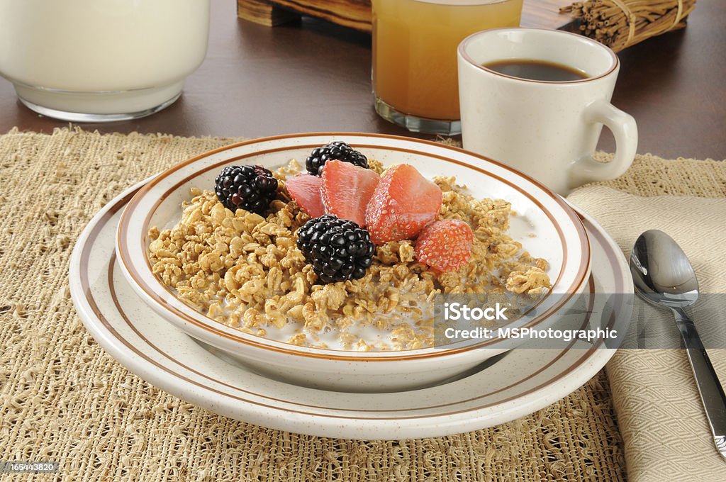 Granola with strawberries and blackberries A bowl of granola with strawberries and blackberries Almond Stock Photo