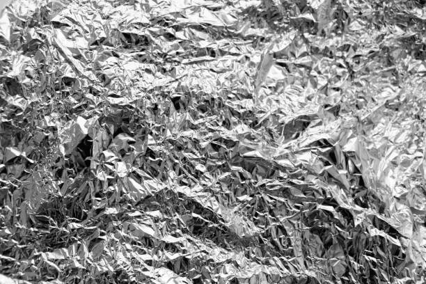 istock Finely crumpled aluminum foil texture 1654490087