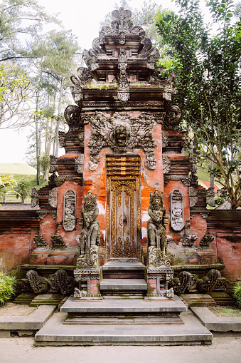 Traditional balinese handmade carved wooden door. Bali style furniture with ornament details

Tirta Empul temple is an ancient Hindu Balinese water temple located near the town of Tampaksiring, Bali, Indonesia.