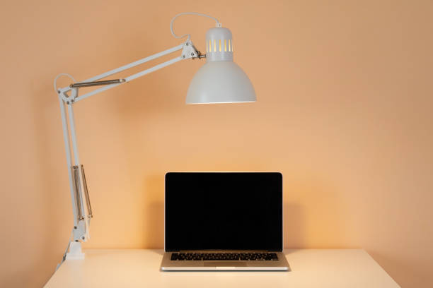 istock Laptop and table lamp, concept for online school or home study. 1654524621