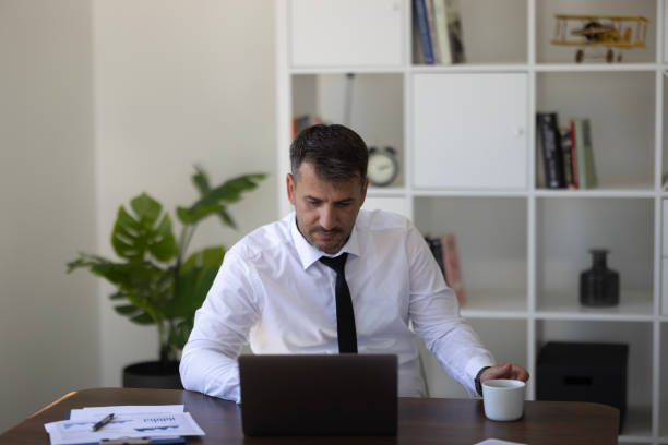 istock Businessman working on a laptop computer in the office 1654525081