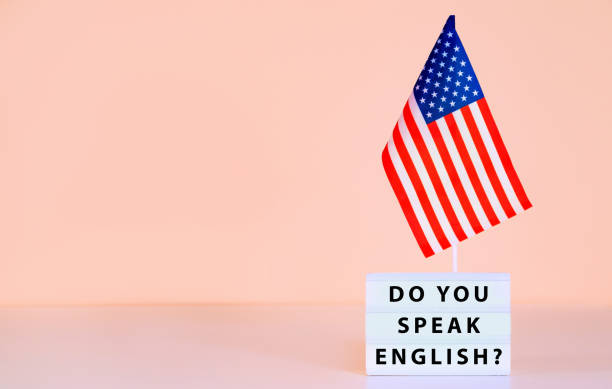 istock USA flag and text question Do You Speak English? 1654526806