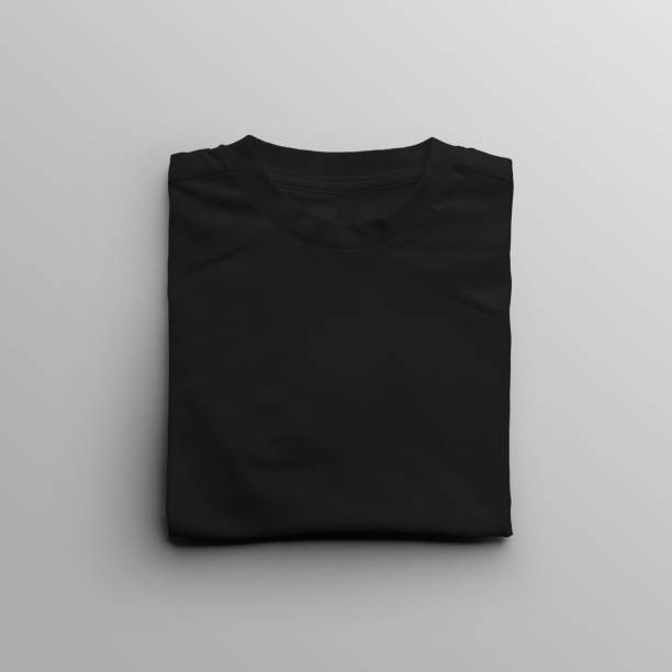 istock Folded black kid's t-shirt template, empty clothes closeup, front view, isolated on background. 1654527344