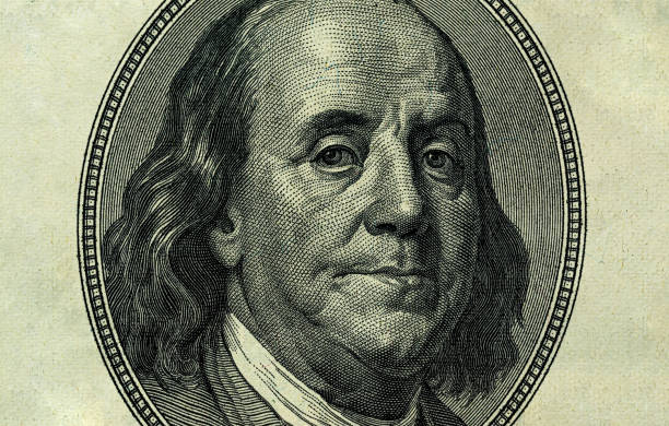 istock Ben Franklin's face on the old US $100 dollar bill. Macro grunge style photo. Large resolution, large size, high quality. 1654535329