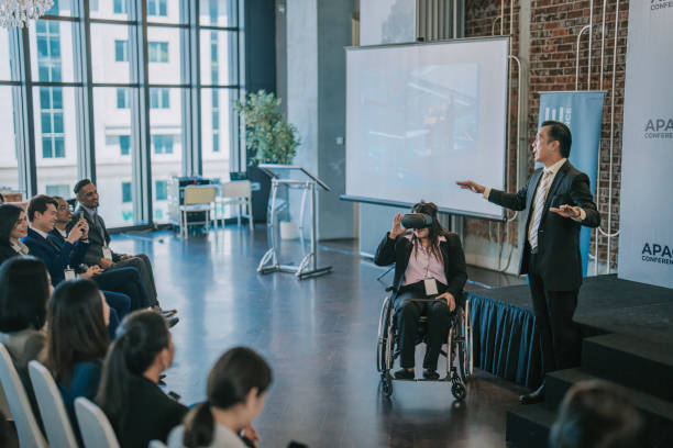 istock Asian Entrepreneur explaining demonstrate to business conference participants on VR google functionality  in workshop 1654535429