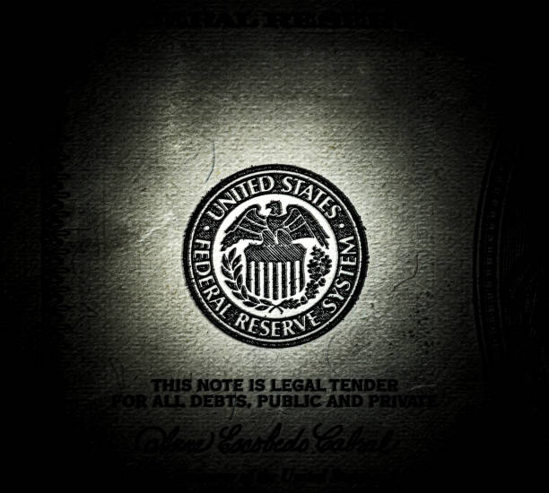 Symbol of the US Federal Reserve System on the old US 100 dollar bill. Fed emblem close-up on american currency. Macro grunge style photo. Symbol of the US Federal Reserve System on the old US 100 dollar bill. Fed emblem close-up on american currency. Macro grunge style photo. dollar bill eagle stock pictures, royalty-free photos & images