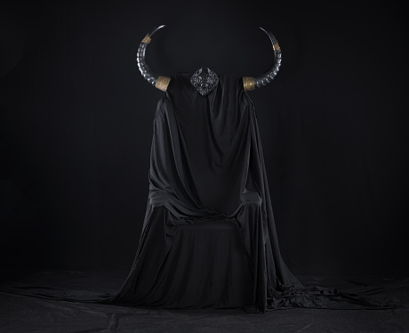black throne devil on a black background