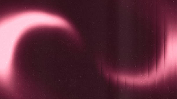 istock Crystal blurred pink gradient tones abstract on dark grainy background. 1654549560
