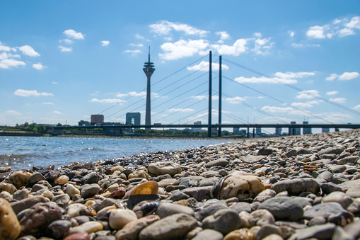 The Düsseldorf skyline on a beach near the Rhine on a sunny summers day