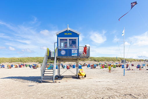 Langeoog, Germany, August, 28, 2023 - Lifeguard station or tower by DLRG, which translates as German Life Saving Association. Water Rescue at the beach of Langeoog