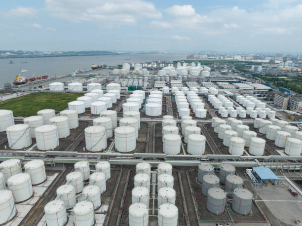 istock Oil storage warehouse by the canal 1654634653