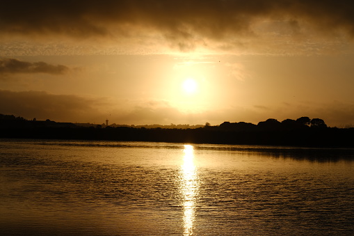A beautiful landscape at dusk. The wide lagoon of the Salted Marshes, Guerande, France. August 2023.