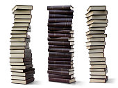 Three high stacks of books with shadows isolated on a white background
