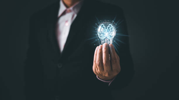 istock person hand holding power lightbulb and pretend to think, inspiration, creativity and imagination concept, innovation technology success business. Digital transformation. Ai technology. 1654678390