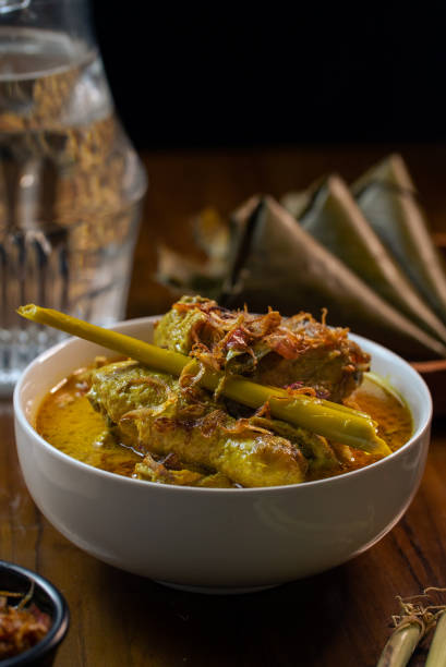 istock Opor Ayam (Chicken Curry) and Ketupat Lebaran (Rice Cake) 1654696208