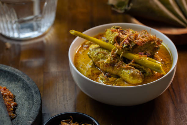 istock Opor Ayam (Chicken Curry) and Ketupat Lebaran (Rice Cake) 1654696797
