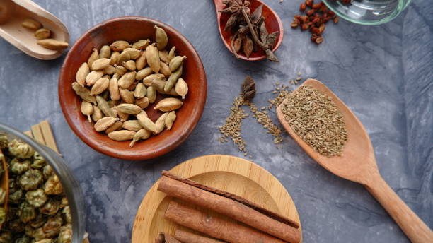 istock Top view herbs and spices on a grey stone table. 1654697339