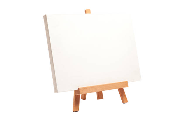 istock Artist wooden easel with canvas isolated on white 1654728807