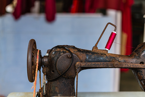 An antique sewing machine is an old sewing device. It's operated manually, and some are still functional. People collect them for their history and design. They can be decorative and evoke a sense of nostalgia for traditional sewing.