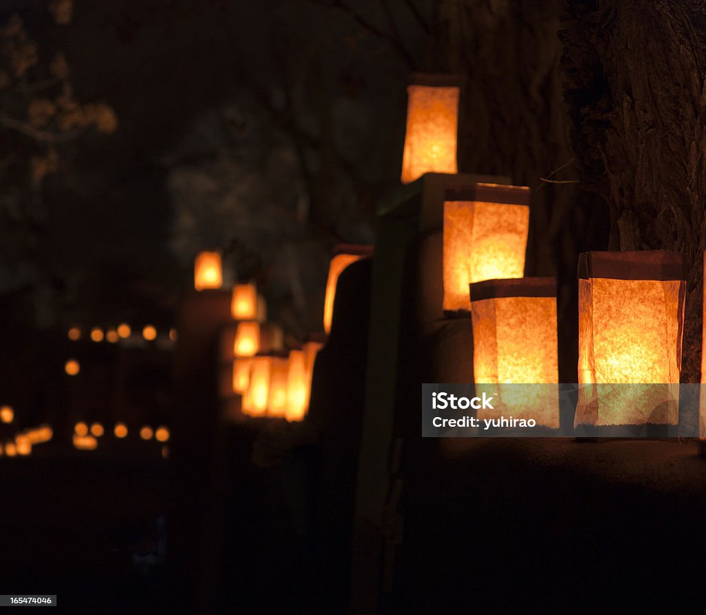 Santa Fe Luminarias at Christmas Special Chrismas Luminarias (Christmas lantern composed of a candle placed inside a paper bag) on the walls of houses with trees behind in Santa Fe, NM, USA. Taken at Christmas Walk on Christmas Eve. Christmas Stock Photo