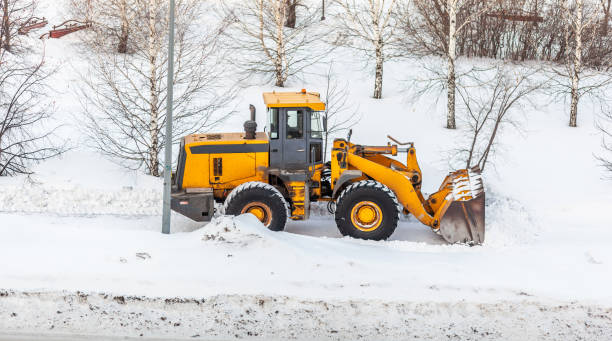 istock Snow clearing. Tractor clears the way after heavy snowfall. 1654765546
