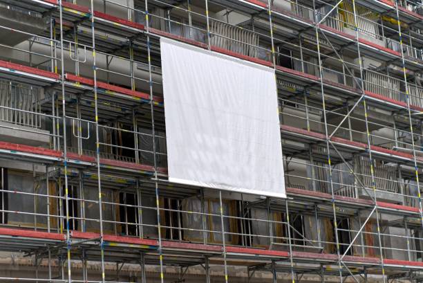 istock Advertising banners on a scaffolding of a new construction site. 1654766611