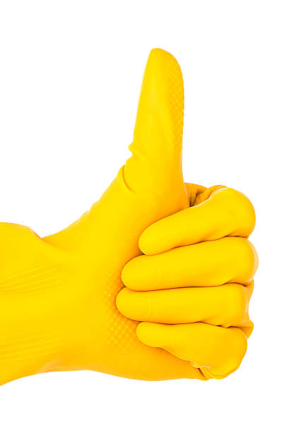 istock thumb in yellow glove isolated on white background:Well done ! 165476764