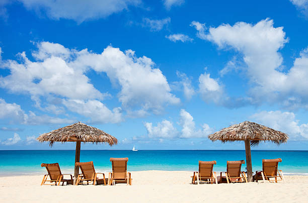 istock Chairs and umbrellas on tropical beach 165478004
