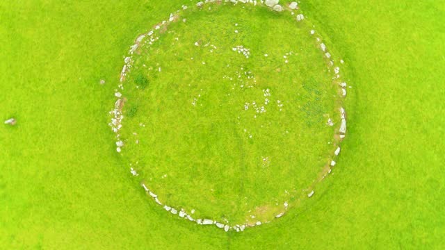 Aerial rotating top-down view of the famous Beltany stone circle, impressive Bronze Age ritual site located to the south of Raphoe town, County Donegal, Ireland. Dating from circa 2100-700 BC.
