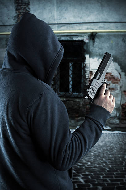 istock Gangster with gun at night 165478837