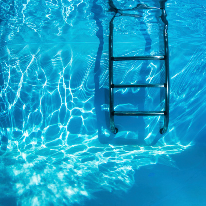 Swimmingpool Ladders Underwater in a clear freshwater.