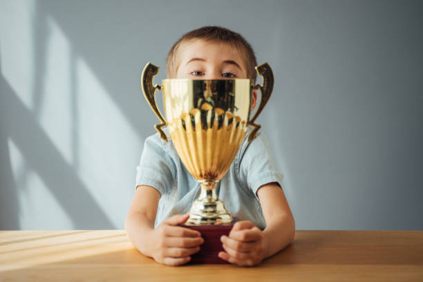 istock The little boy with the trophy he won 1654798601