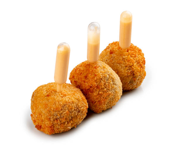 istock Cheese balls deep-fried with white sauce. Isolated image on a white background. 1654798611