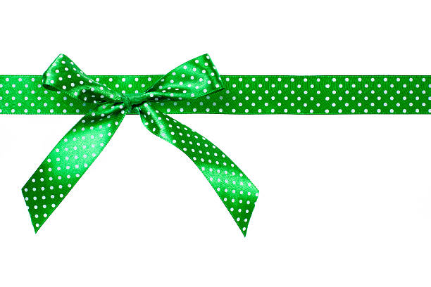 Green gift bow and ribbon on white background