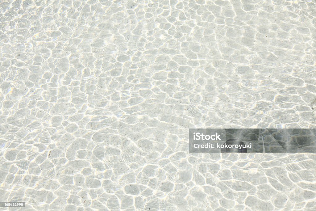Pofałdowany wody na piasek - Zbiór zdjęć royalty-free (Abstrakcja)