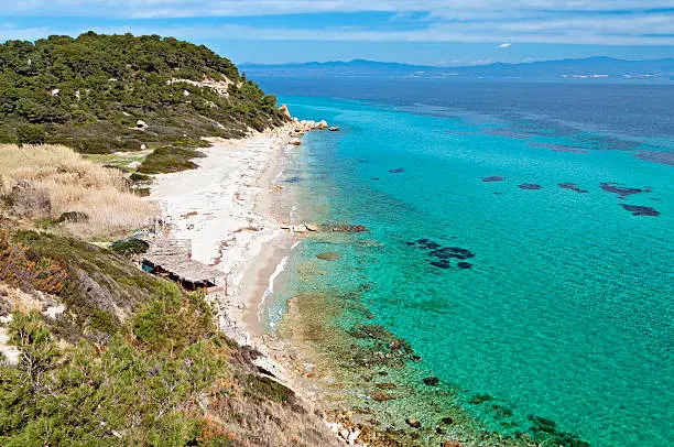 Sunny beach and summer resort at Kassandra of Halkidiki peninsula in Greece