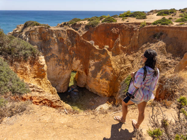 istock Woman observing natural landscape 1654845732