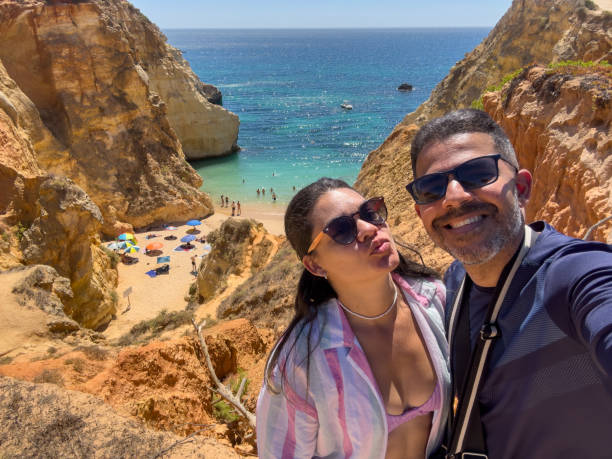 istock Couple on vacation at the beach 1654845734