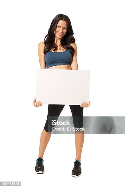 Young Woman Fitness Trainer With Blank Sign On White Stock Photo - Download Image Now