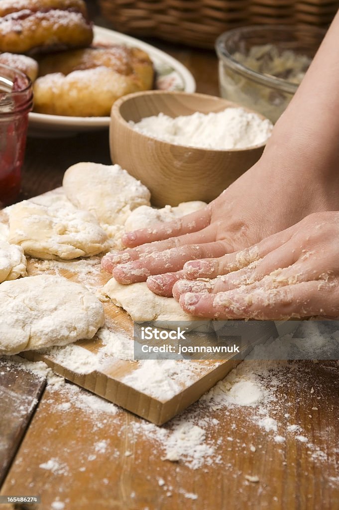 Detail of hands kneading dough Adult Stock Photo