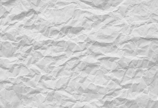 istock Crumpled and wrinkled white paper surface 1654862813