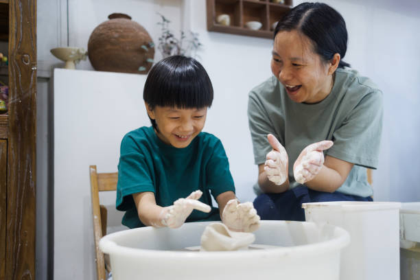 two redhead sisters make a pitcher of a pottery wheel