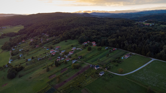 Picturesque village of Reber in dolenjska region of Slovenia on a sunny evening sunset,with visible typical small houses or weekend homes called Zidanica used mainly for winegrowing.