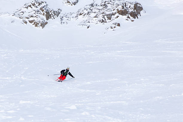 Skier turning in powder snow stock photo