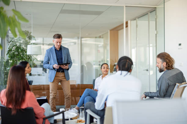 istock Manager Checking A Digital Table While Listening A Question Of One Of His Coworkers 1654900822