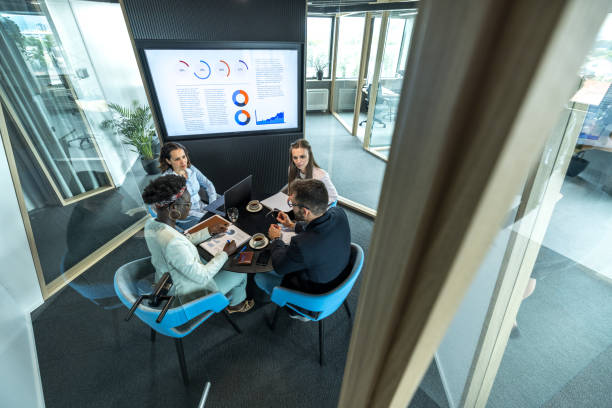 istock High Angle View Of A Multicultural Marketing Team Inside A Modern Office 1654902040