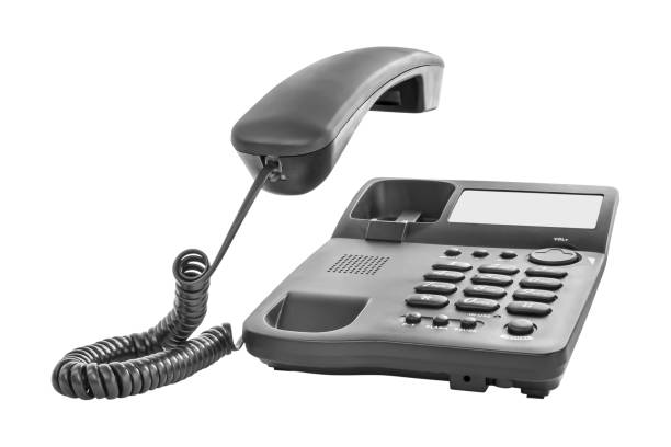 istock Phone ringing. Office telephone with the receiver up. Isolated on white 1654910520