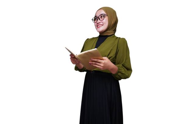 istock Smiling asian hijab woman reading a book 1654911254